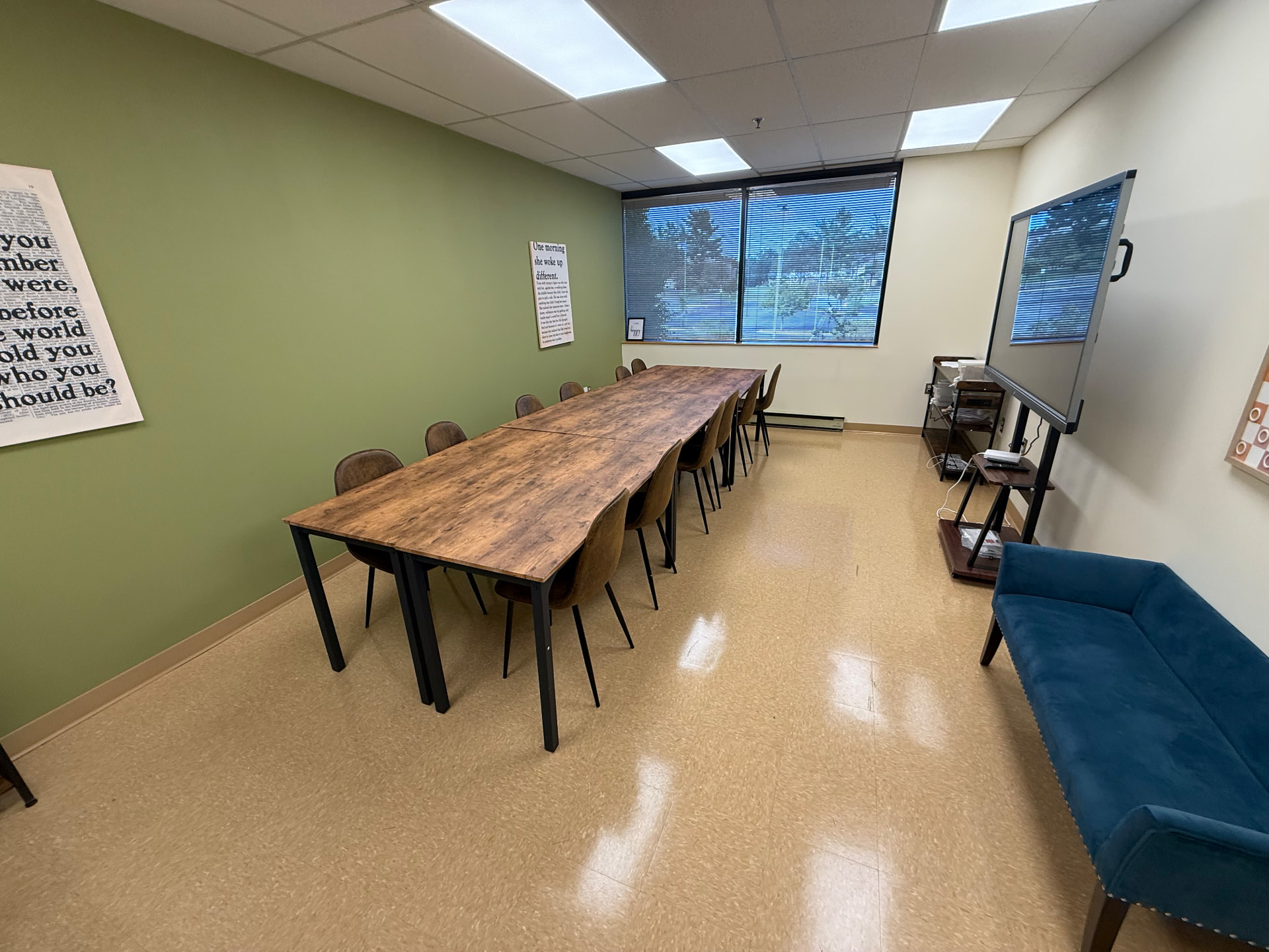 Meeting Room 2 at The Self Care Sanctuary Suites with a conference table, chairs, TV and window
